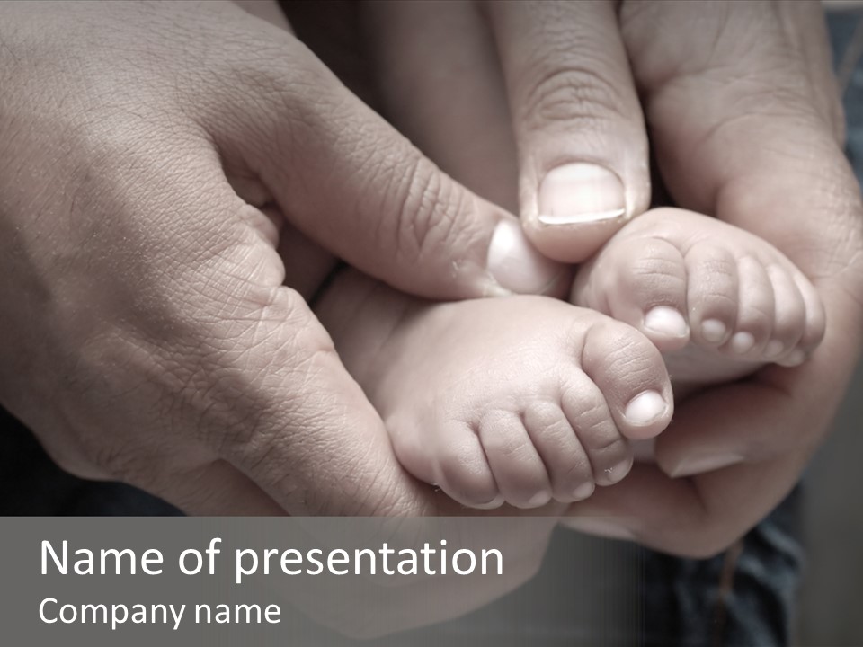 Father Hands Holding Baby's Feet- Sepia Tone, Low Dof PowerPoint Template