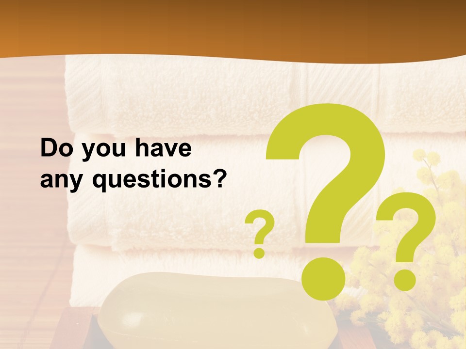 A Bunch Of Towels Sitting On Top Of A Wooden Table PowerPoint Template