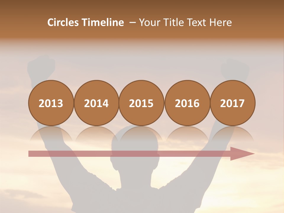 A Man Raising His Arms In The Air At Sunset PowerPoint Template