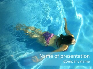 Girl Swimming Underwater In A Swimming Pool PowerPoint Template