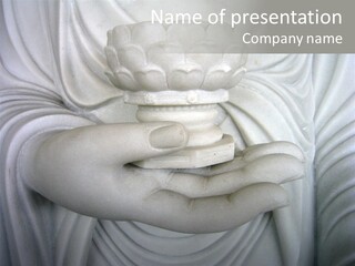 A Person Holding A Statue With Their Hands PowerPoint Template