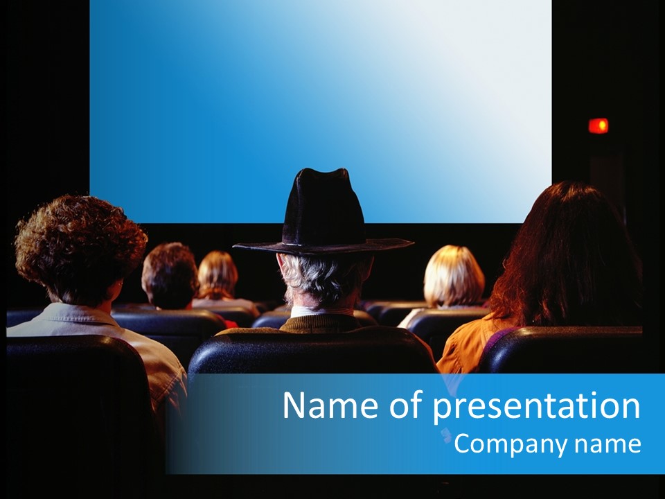 A Group Of People Watching A Movie On A Screen PowerPoint Template