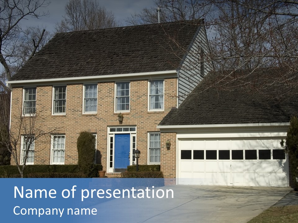 A Large Brick House With A Blue Door PowerPoint Template
