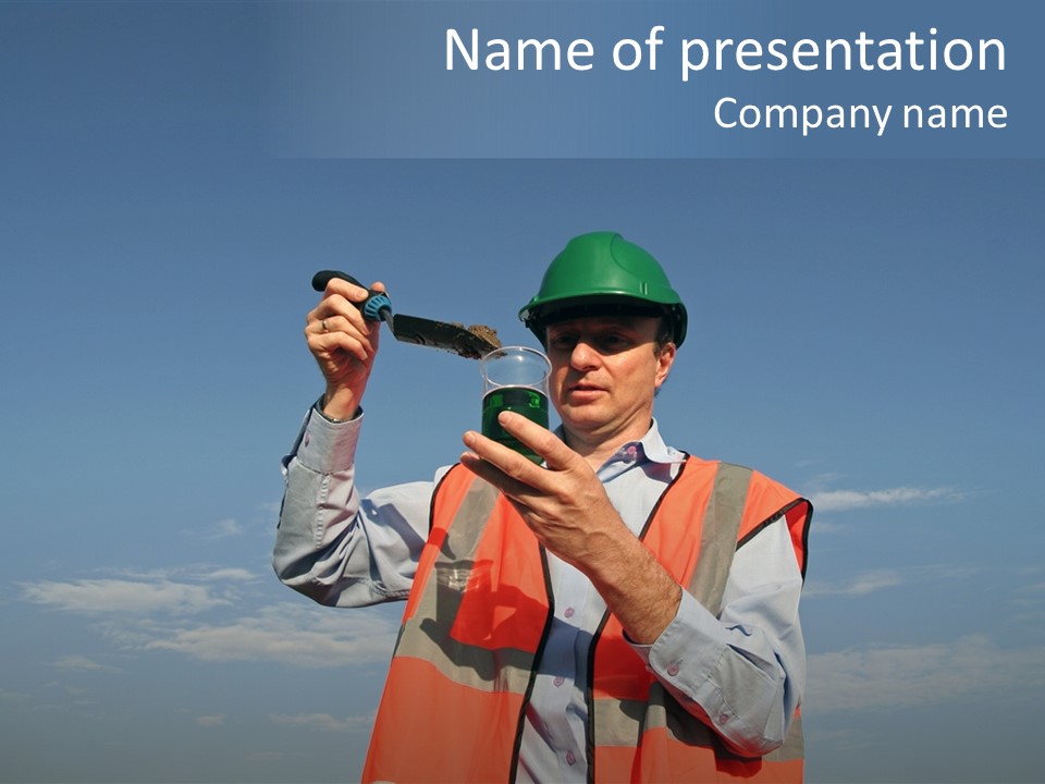 An Environmental Engineer, Wearing Protective Clothing, Placing A Soil Sample Into A Specimen Jar, Containing A Green Fluid With A Beautiful Blue Sky Behind Him. PowerPoint Template