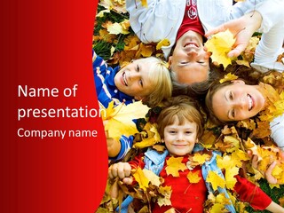 Cute Family In A Park On An Autumn-Day PowerPoint Template