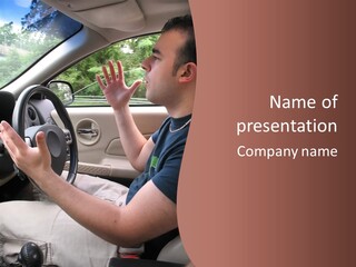 A Young Man Seems To Be Experiencing Some Road Rage While Driving. PowerPoint Template