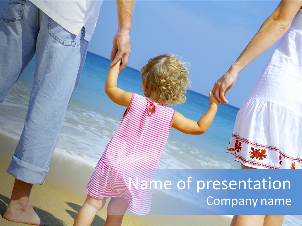 View Of Young Family Having Fun On The Beach PowerPoint Template