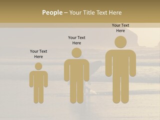 A Surfer Leaves The Surf As The Sun Sets At Polzeath Beach In Cornwall, Uk. PowerPoint Template