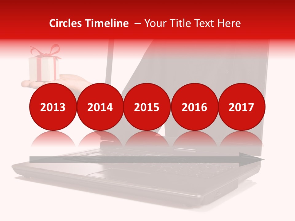 A Person Holding A Present In Front Of A Laptop PowerPoint Template