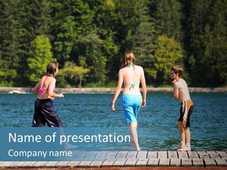 Candid Portrait Of Group Of Children At Lakeside PowerPoint Template