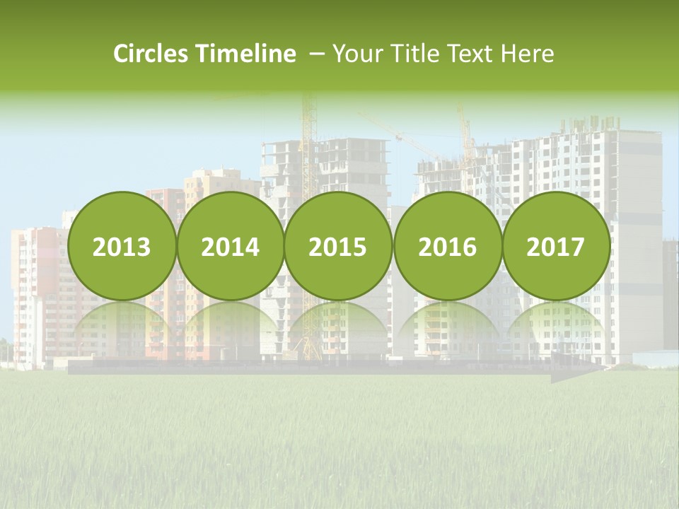 Residential Buildings, Some Of Them Under Construction, With Beautiful Green Field Foreground PowerPoint Template