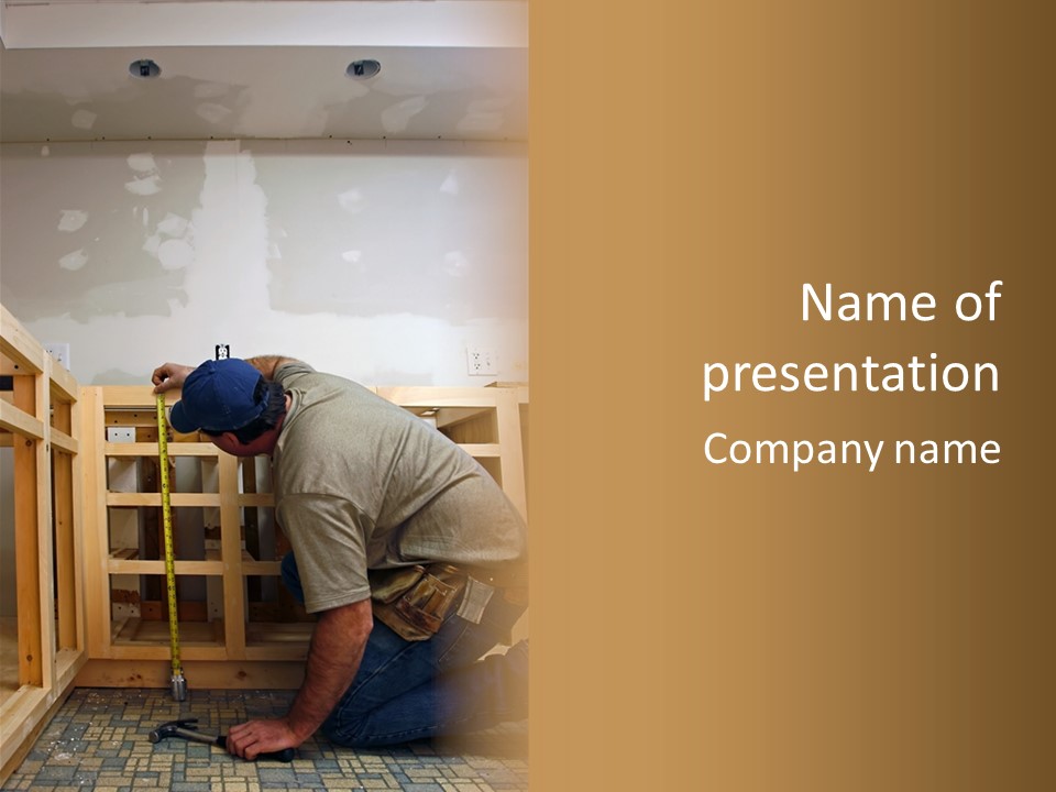 Finish Carpenter Working On Custom Home Cabinets In Home Kitchen PowerPoint Template