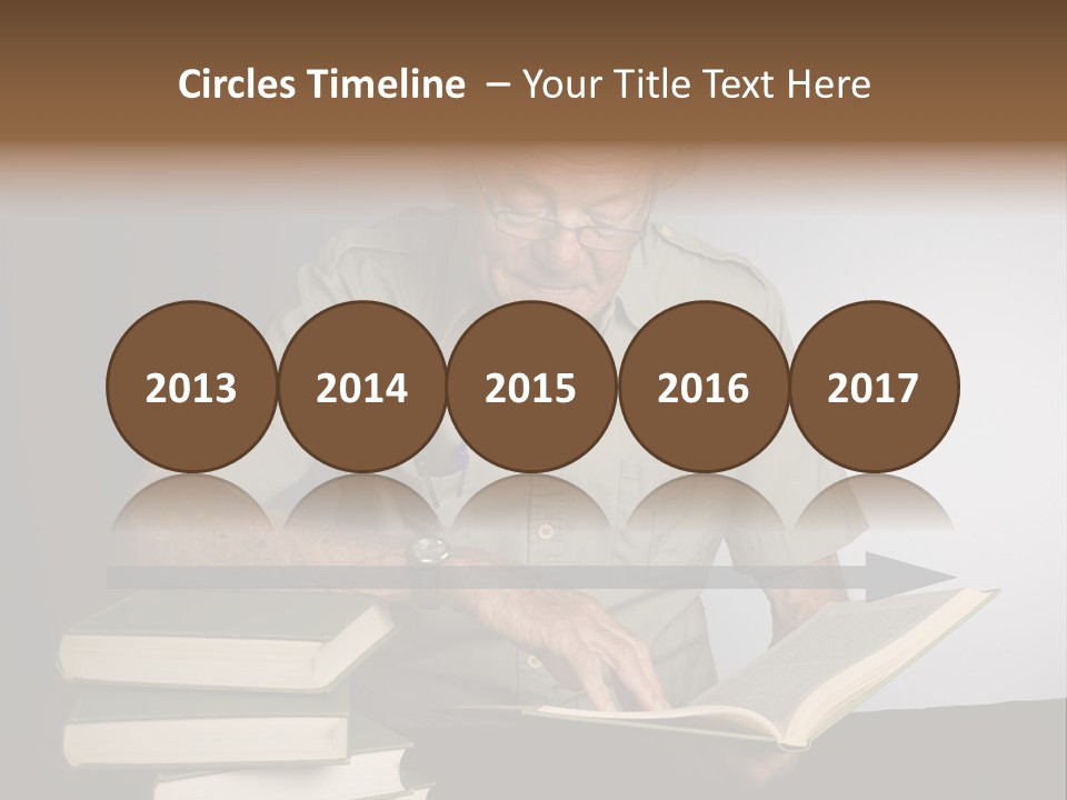 A Man Sitting At A Table With A Stack Of Books PowerPoint Template