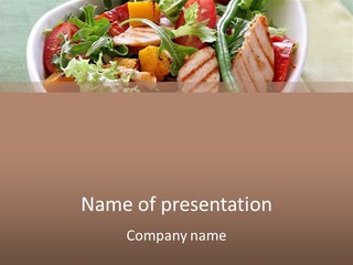 A Bowl Of Salad With Meat And Vegetables On A Table PowerPoint Template