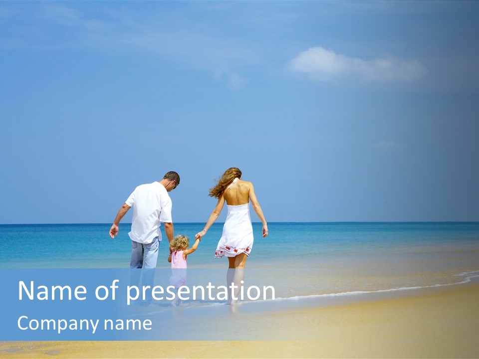 View Of Young Family Having Fun On The Beach PowerPoint Template