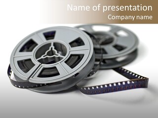 Still Life Of 8Mm Cine Film And Reels; Isolated On White Ground; Differential Focus PowerPoint Template