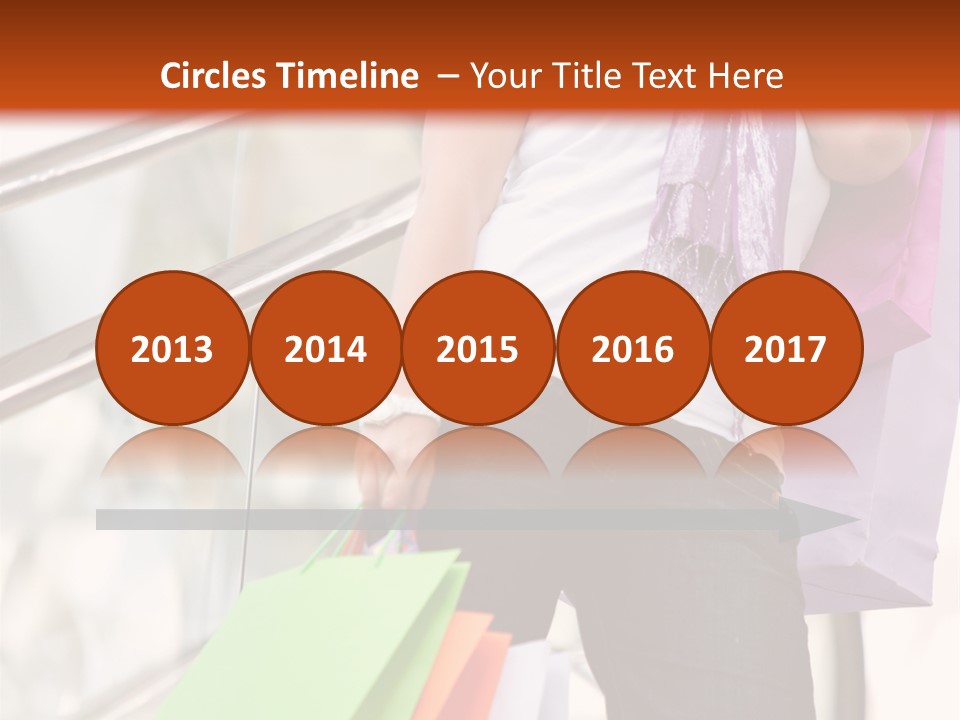 Woman On Scalators In A Shopping Mall Holding Some Bags PowerPoint Template