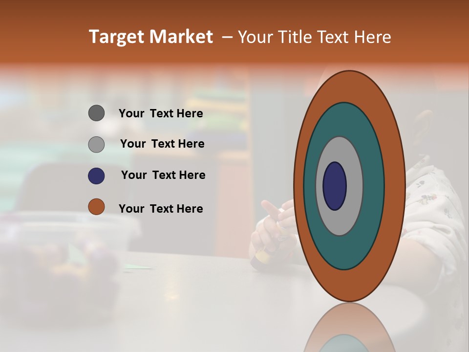 A Baby Sitting At A Table Playing With A Toy PowerPoint Template