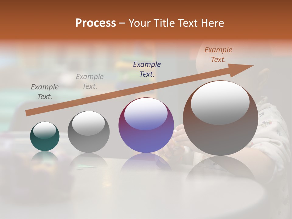 A Baby Sitting At A Table Playing With A Toy PowerPoint Template