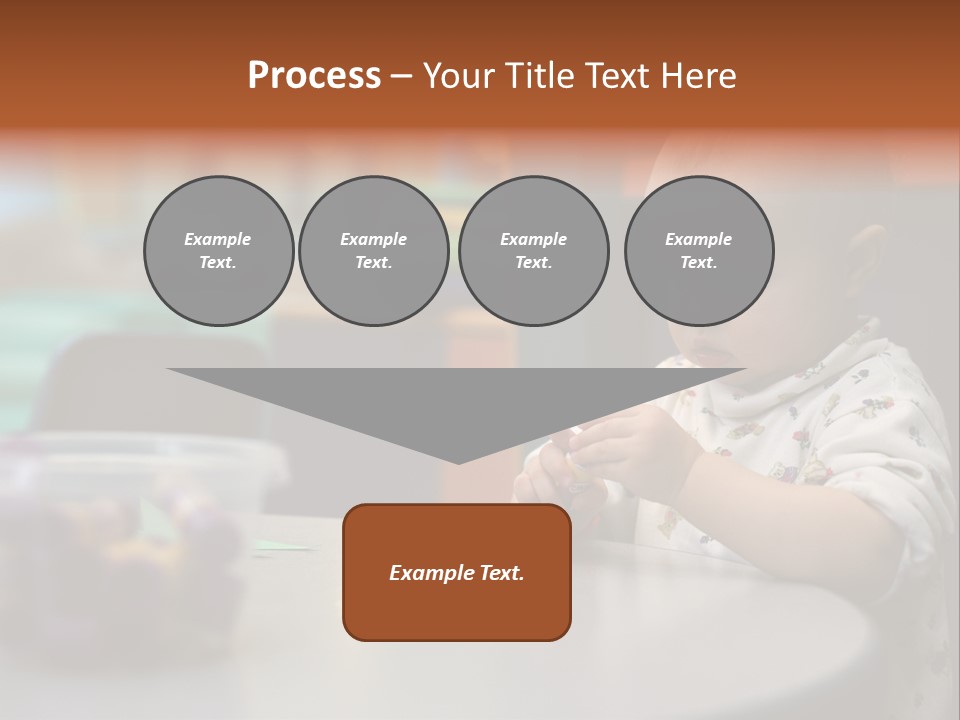 A Baby Sitting At A Table Playing With A Toy PowerPoint Template