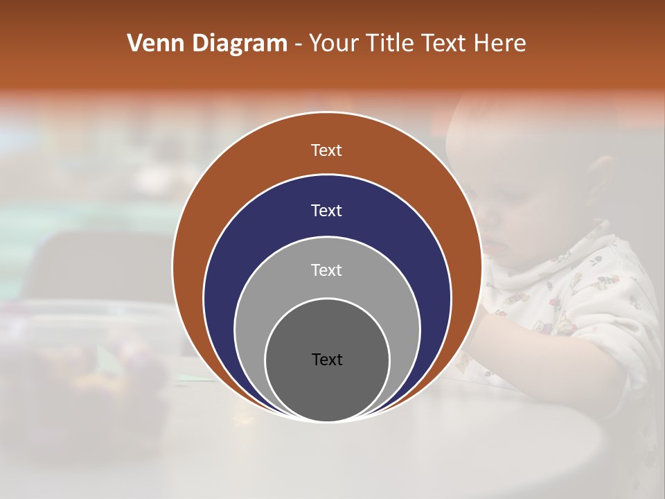 A Baby Sitting At A Table Playing With A Toy PowerPoint Template