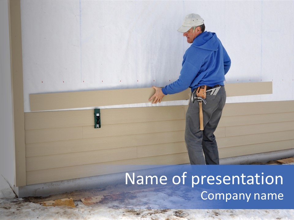 A Man In A Blue Shirt Is Painting A Wall PowerPoint Template