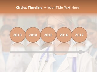 Female Doctor Smiling In A Hospital With Her Team Behind PowerPoint Template