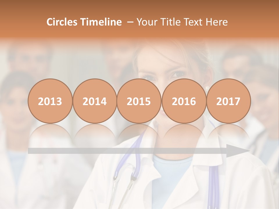 Female Doctor Smiling In A Hospital With Her Team Behind PowerPoint Template