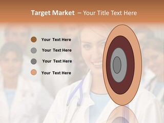 Female Doctor Smiling In A Hospital With Her Team Behind PowerPoint Template