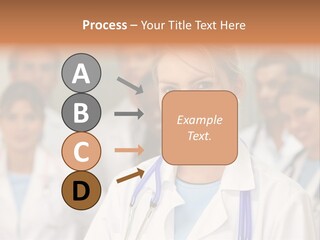 Female Doctor Smiling In A Hospital With Her Team Behind PowerPoint Template