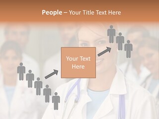 Female Doctor Smiling In A Hospital With Her Team Behind PowerPoint Template