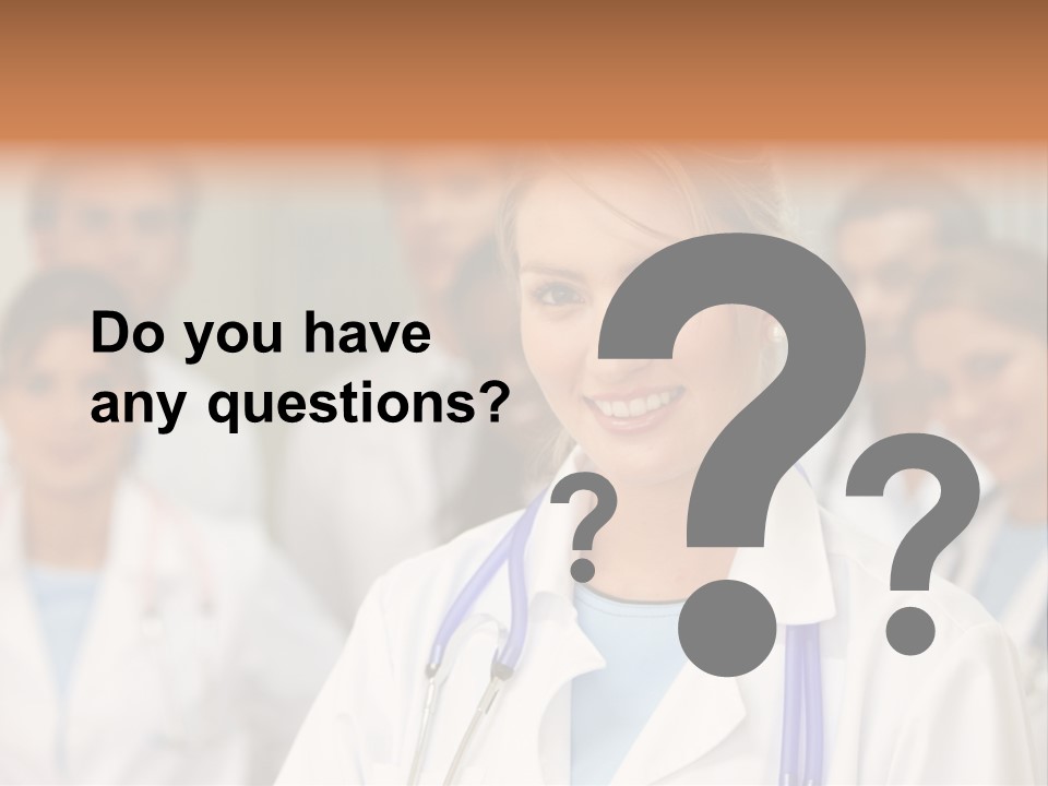 Female Doctor Smiling In A Hospital With Her Team Behind PowerPoint Template