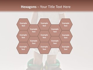 Funny Little Girl In Big Mountain Ski Boots And Short White Dress Stands On White Background PowerPoint Template