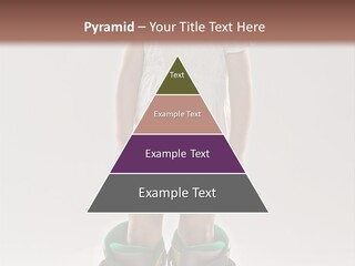 Funny Little Girl In Big Mountain Ski Boots And Short White Dress Stands On White Background PowerPoint Template