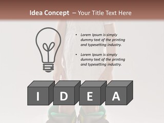 Funny Little Girl In Big Mountain Ski Boots And Short White Dress Stands On White Background PowerPoint Template