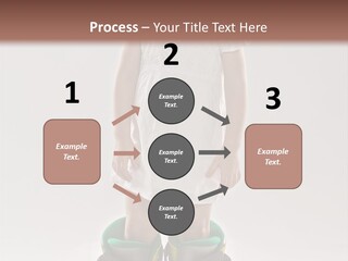 Funny Little Girl In Big Mountain Ski Boots And Short White Dress Stands On White Background PowerPoint Template