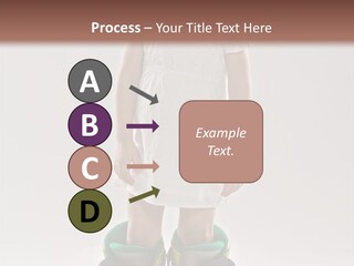 Funny Little Girl In Big Mountain Ski Boots And Short White Dress Stands On White Background PowerPoint Template