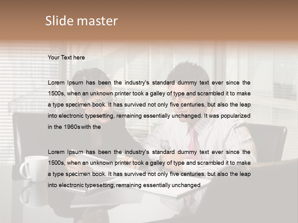 A Man And A Woman Sitting At A Table In Front Of A Laptop PowerPoint Template