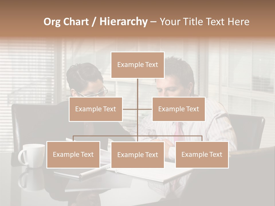 A Man And A Woman Sitting At A Table In Front Of A Laptop PowerPoint Template