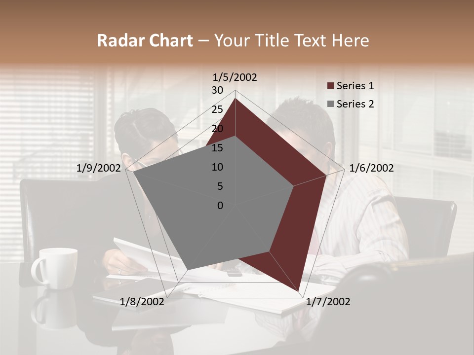 A Man And A Woman Sitting At A Table In Front Of A Laptop PowerPoint Template