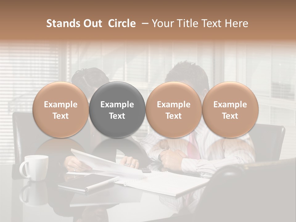 A Man And A Woman Sitting At A Table In Front Of A Laptop PowerPoint Template