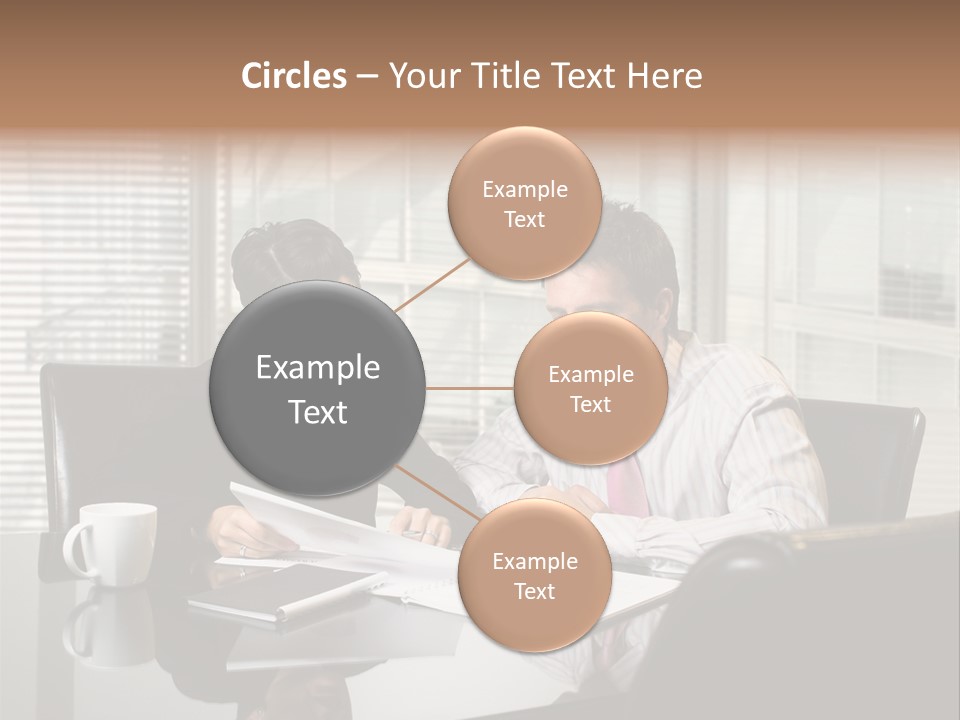 A Man And A Woman Sitting At A Table In Front Of A Laptop PowerPoint Template