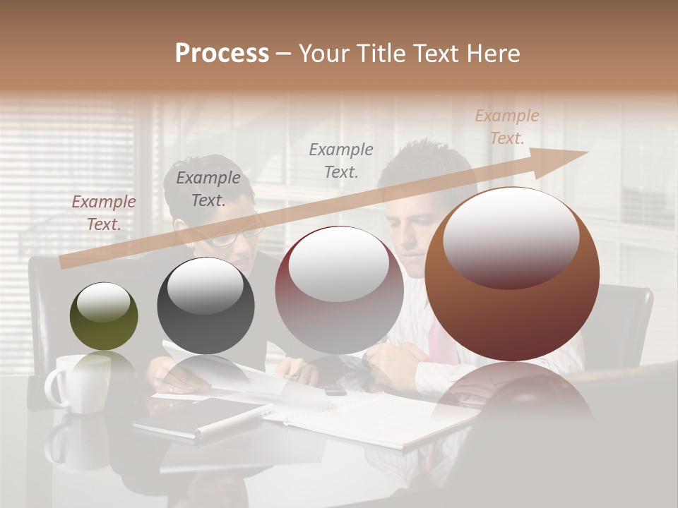 A Man And A Woman Sitting At A Table In Front Of A Laptop PowerPoint Template