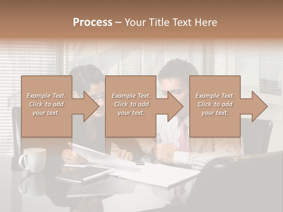 A Man And A Woman Sitting At A Table In Front Of A Laptop PowerPoint Template