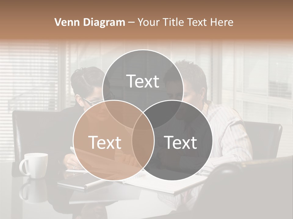 A Man And A Woman Sitting At A Table In Front Of A Laptop PowerPoint Template