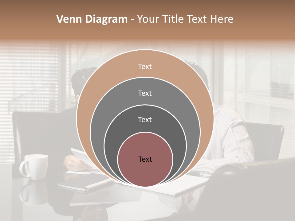 A Man And A Woman Sitting At A Table In Front Of A Laptop PowerPoint Template