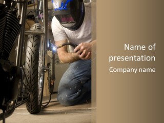 Welder Working On The Metal Fork Of A Motorcycle PowerPoint Template