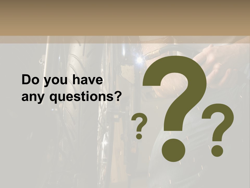 Welder Working On The Metal Fork Of A Motorcycle PowerPoint Template