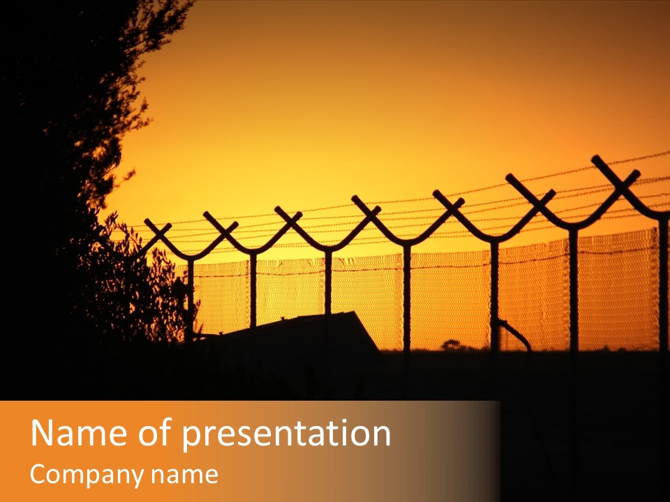 Barbed Wire Perimeter Fence At Sunrise. PowerPoint Template