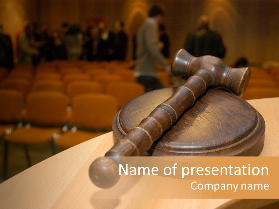 A Judge's Gaven Sitting On Top Of A Table In Front Of A PowerPoint Template